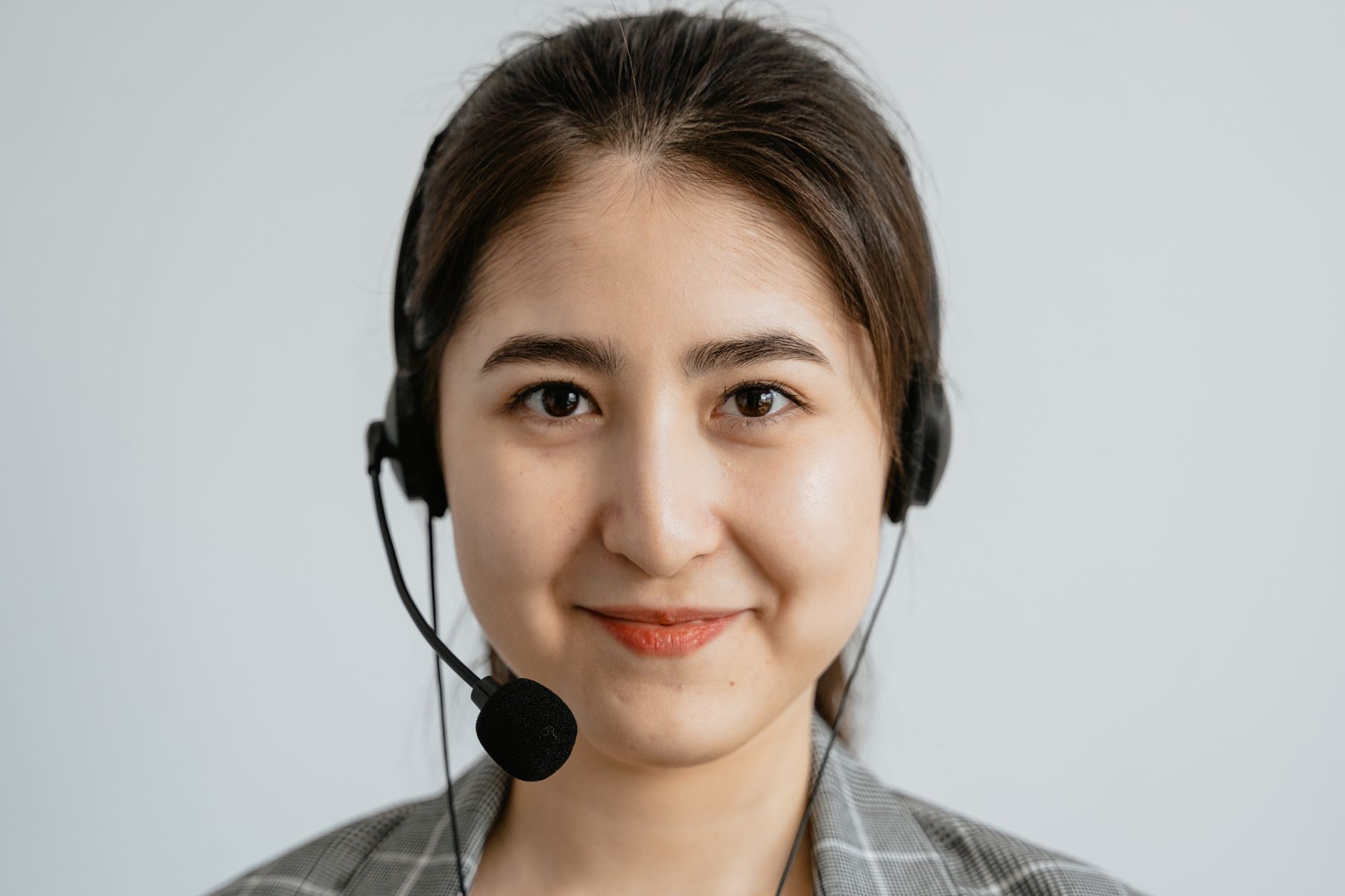 Nyelvora support specialist ready to help with a headset