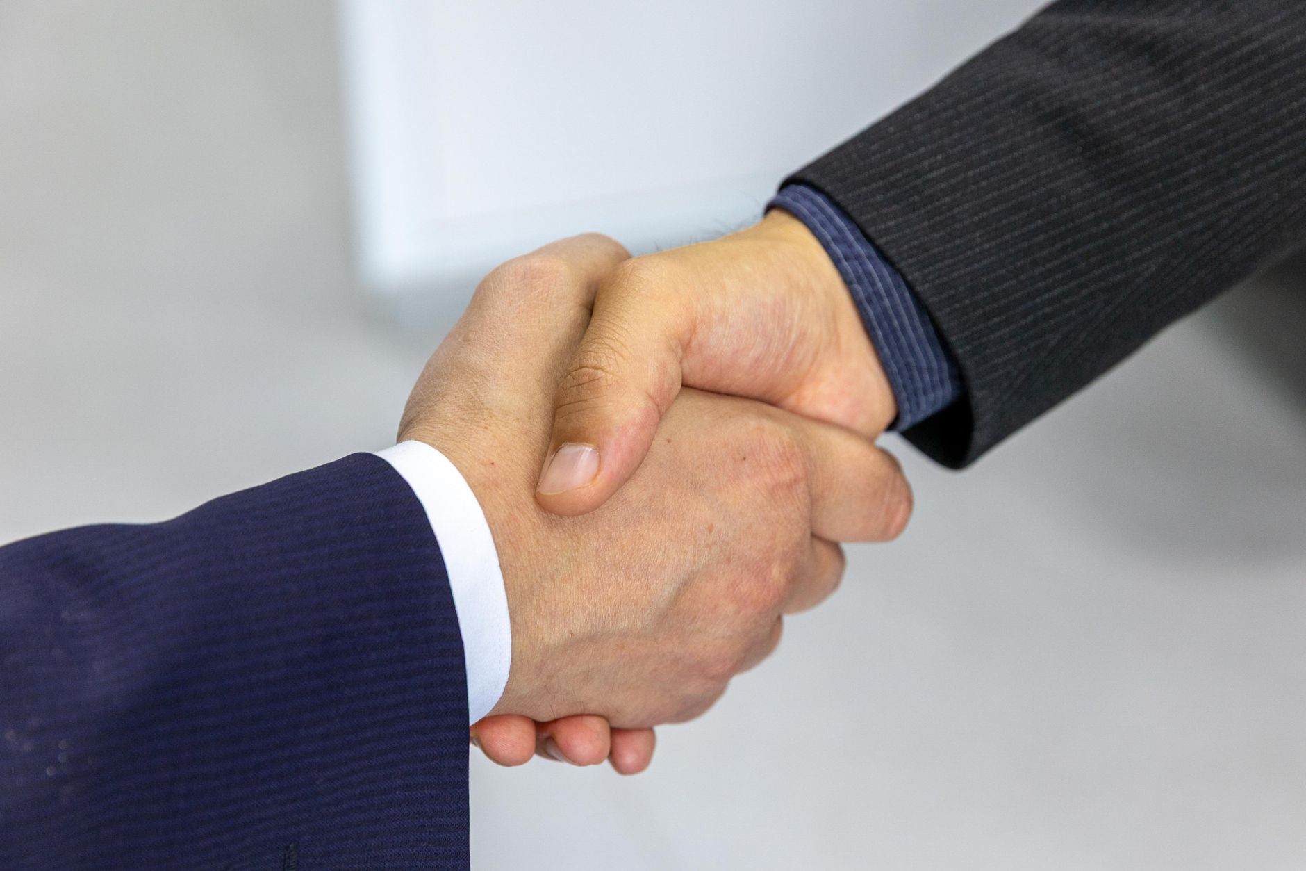 Business professionals practicing a negotiation in English