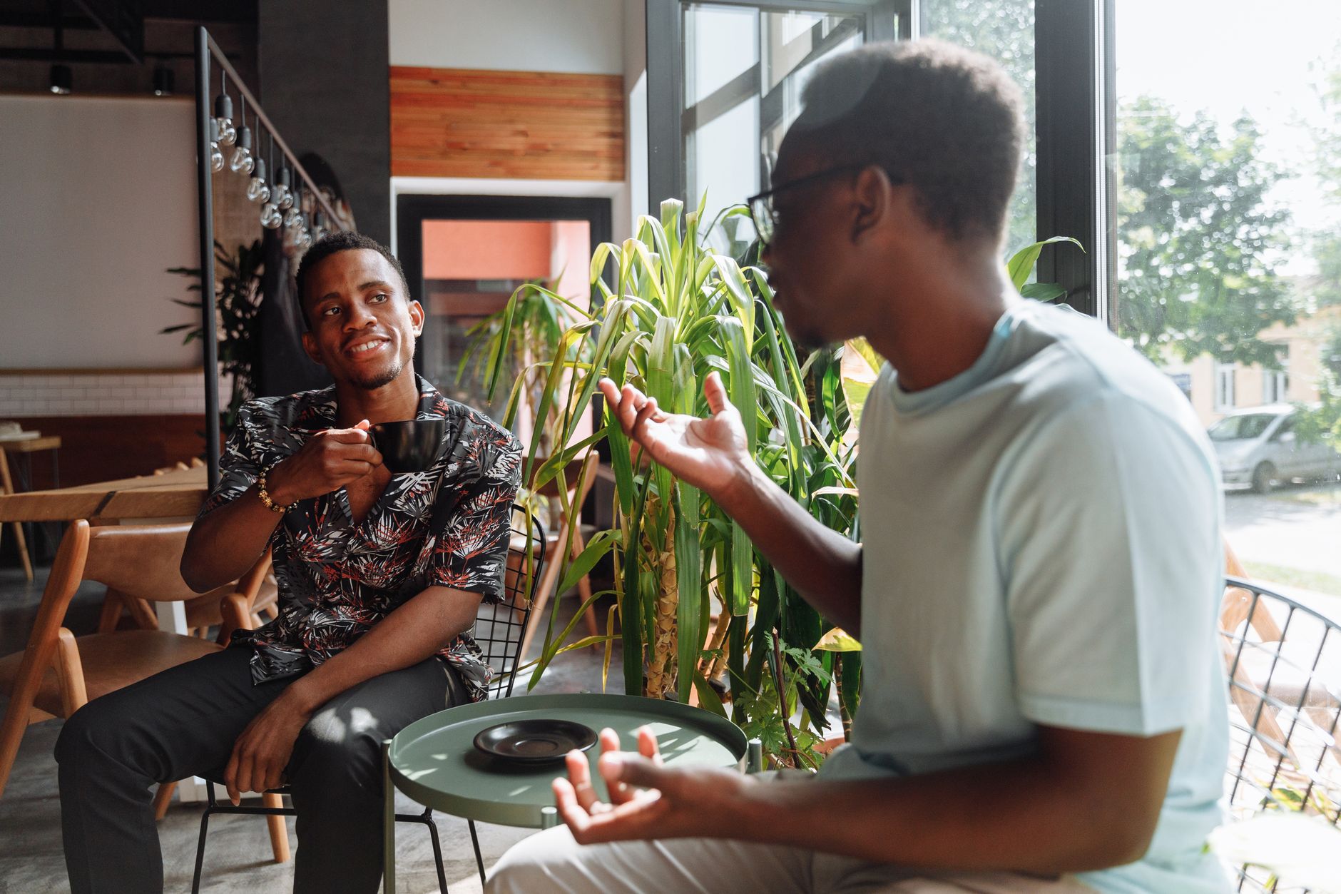 Two people practicing conversation at a coffee shop