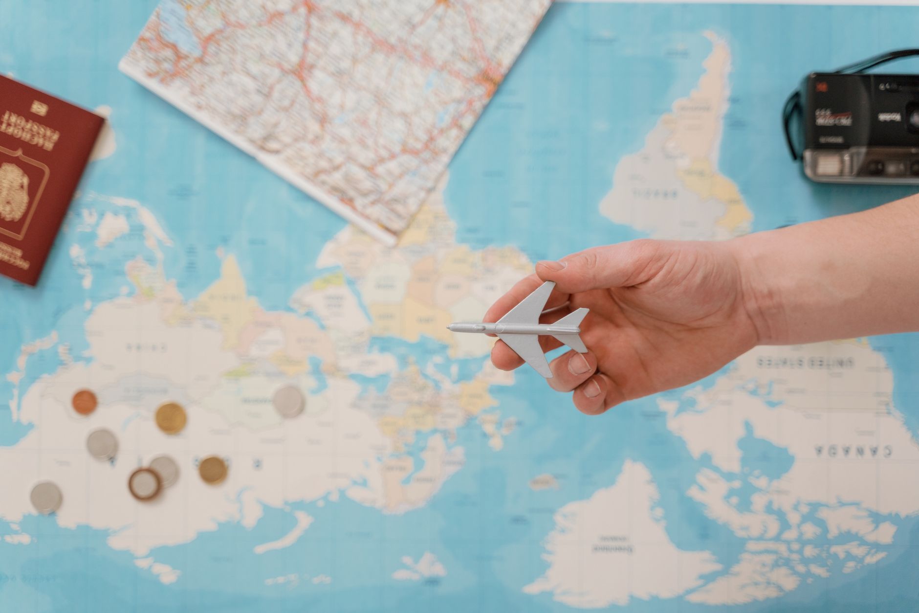 Traveler holding a passport and planning a trip